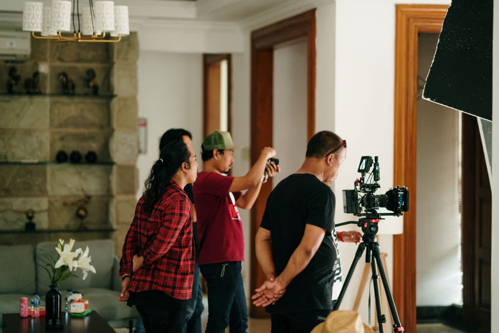 Film crew working around a camera